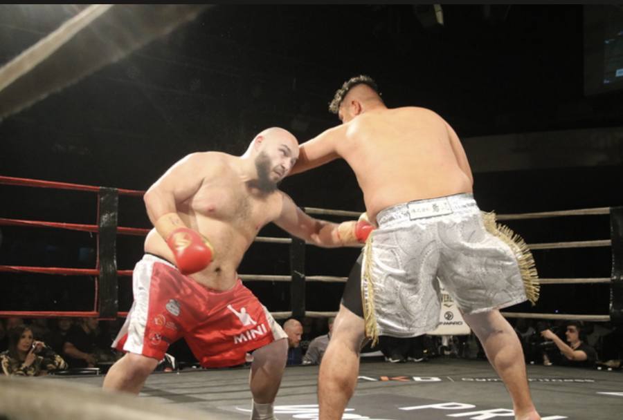 Two boxers sparring in the ring